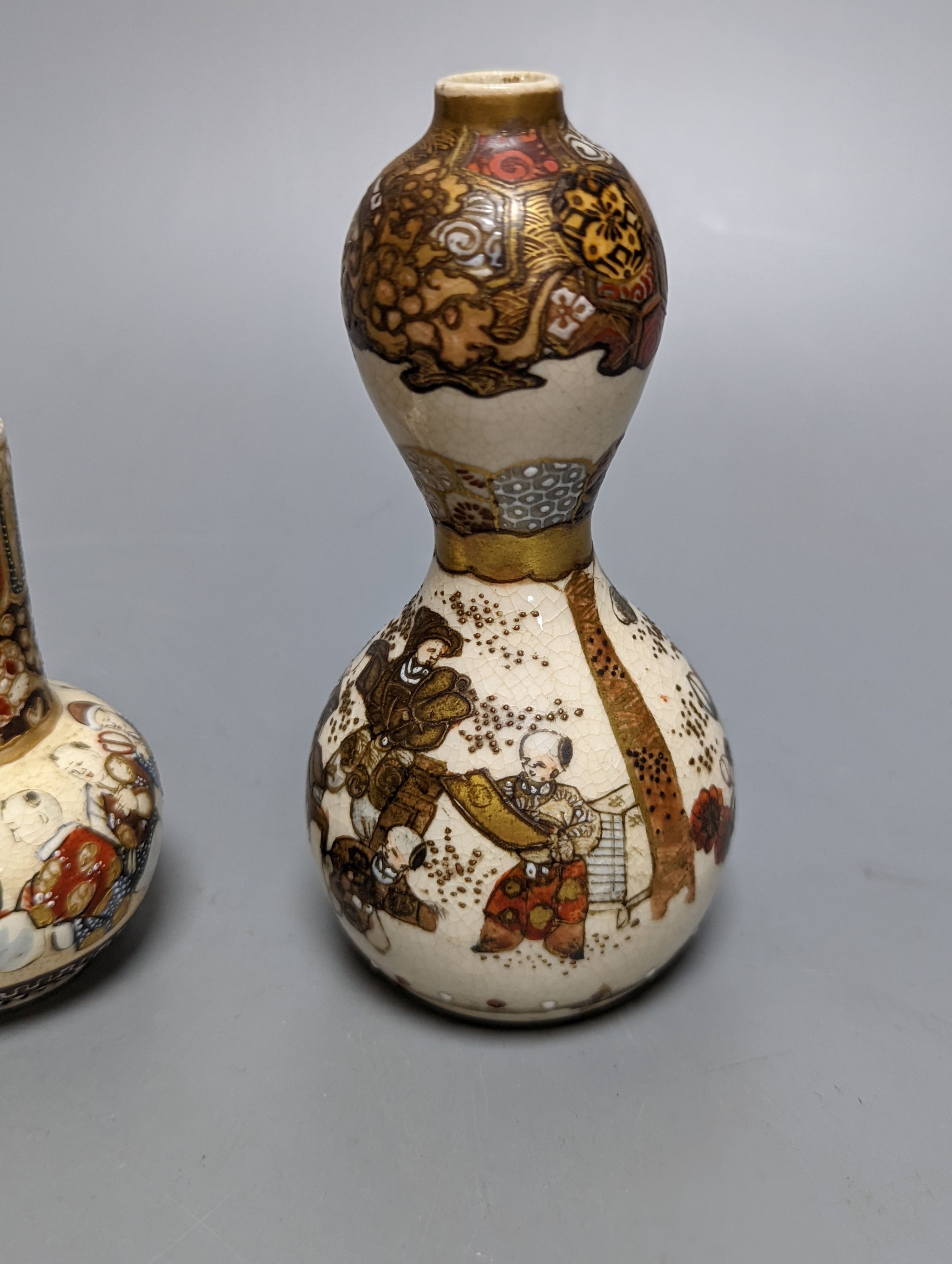 Three Japanese graduated porcelain miniature bowls, a pair of small Satsuma vases and another, pair of vases 12 cms high (6)